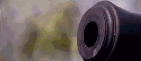 a close up of a cannon barrel with a hole in it .
