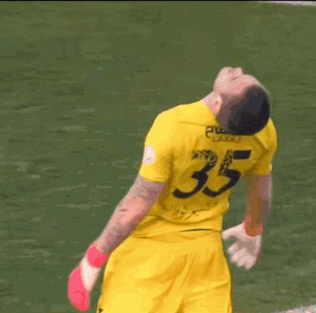 a soccer player with the number 35 on his shirt