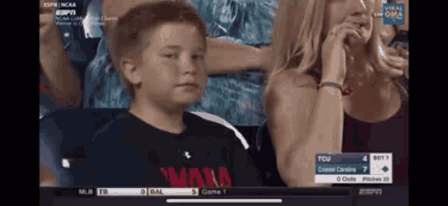 a young boy wearing a black shirt that says wans