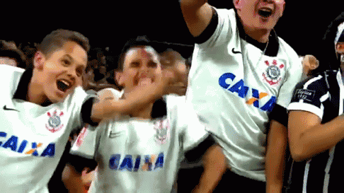 a group of people wearing shirts that say caixa on them