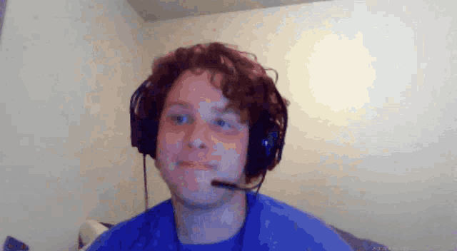 a man wearing headphones with a microphone on his face