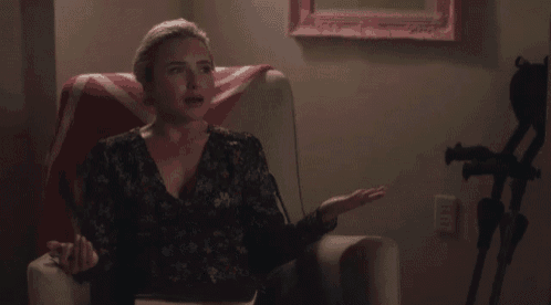 a woman is sitting in a chair saying i 'm just being honest