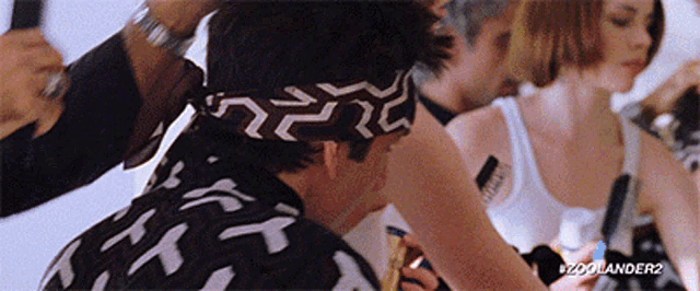 a man wearing a black and white bandana with the words zoolander2 on the bottom