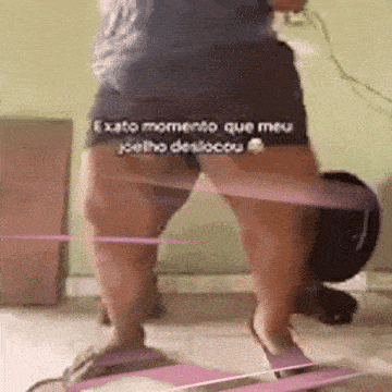 a person is standing in front of a vacuum cleaner with their legs crossed .