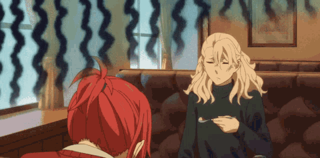 a man with blonde hair is holding a spoon and talking to a woman with red hair