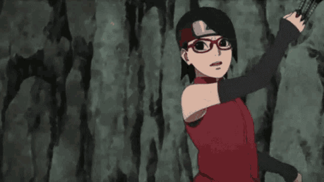 a girl in a red dress and glasses is holding a sword .