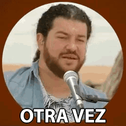 a man with a beard singing into a microphone with the words otra vez written below him
