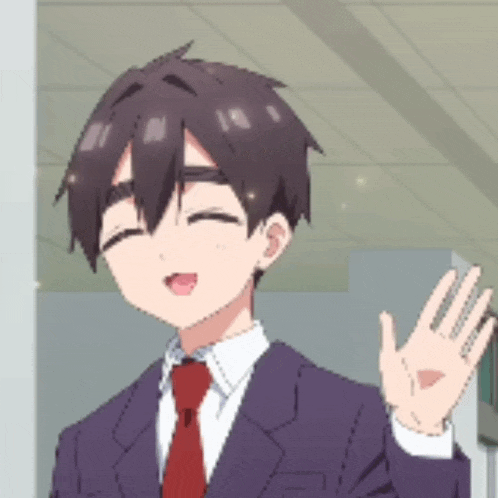 a man in a suit and tie is smiling and waving his hand .
