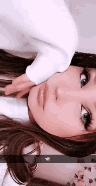 a girl is taking a selfie with a snapchat message that says hi !!