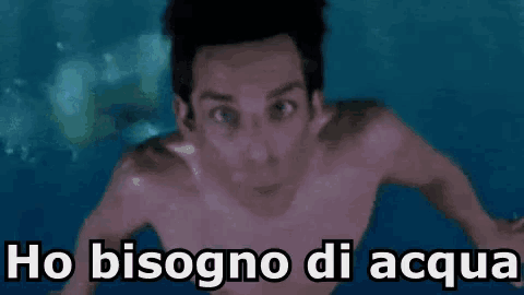 a shirtless man is swimming in the ocean with the words ho bisogno di acqua written below him .