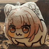 a stuffed animal with a girl 's face on it is laying on the ground .