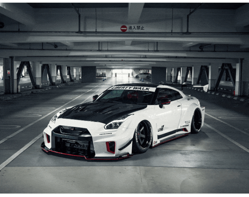 a white liberty walk car is parked in a garage