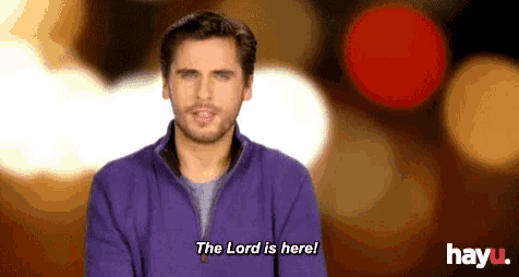 a man in a purple shirt says the lord is here