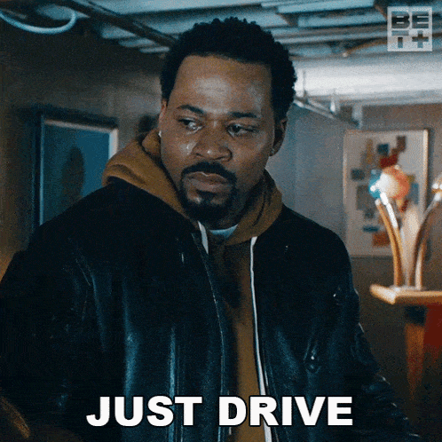 a man in a leather jacket says " just drive "