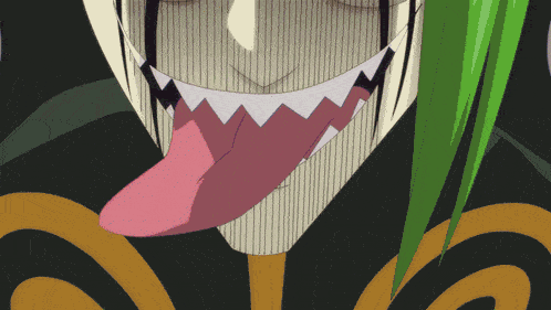 a close up of a person 's face with their tongue hanging out