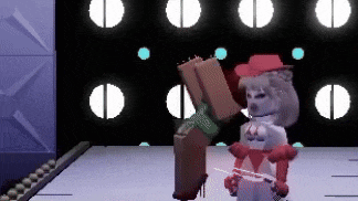 a cartoon character is standing on a stage holding a sword and a box .