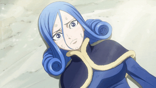 a girl with blue hair and a blue cape is laying on the ground