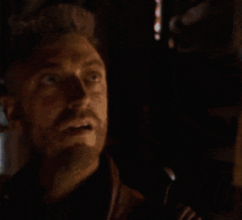 a blurry picture of a man standing in the dark