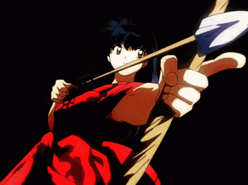 a girl in a red dress is holding a sword in her hand