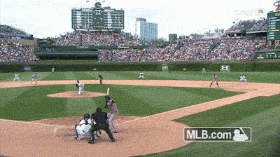 a baseball game is being played in front of a mlb.com banner