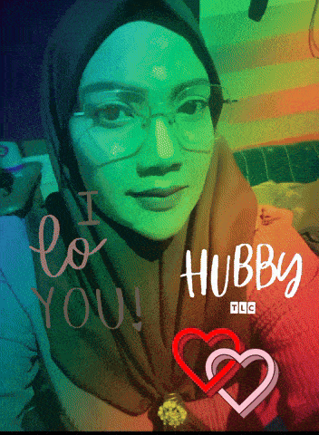 a woman wearing glasses and a hijab says " i love you hubby "