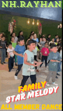a group of children are dancing in front of a nh rayhan sign