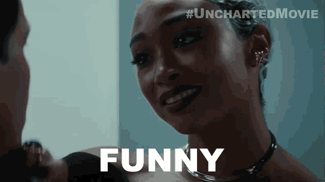 a woman says funny in front of a man 's face