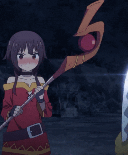 a girl in a red dress is holding a stick with a belt around her waist