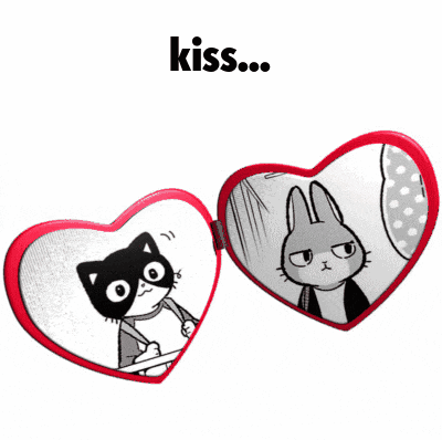 a heart shaped mirror with a cat and a rabbit on it and the word kiss below it