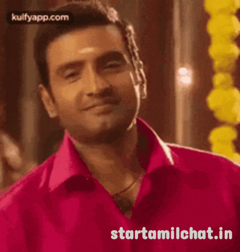 a man in a pink shirt is smiling with the website starttamilchat.in written below him