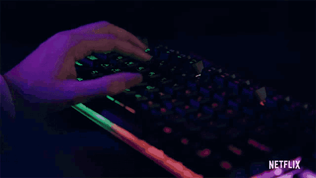 a person is typing on a keyboard with netflix written on the bottom