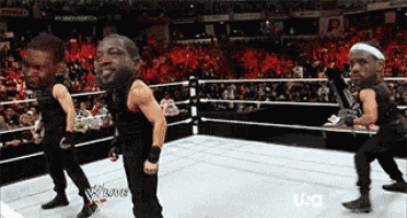 a group of wrestlers are dancing in a ring with a usa logo in the background