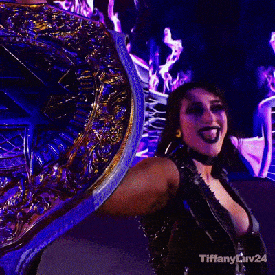 a woman is holding a trophy in front of a screen that says tiffanylev24 on it