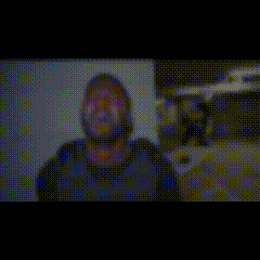 a blurry picture of a person 's face is being displayed on a screen .