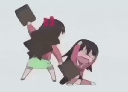 a couple of girls are standing next to each other and fighting with each other .