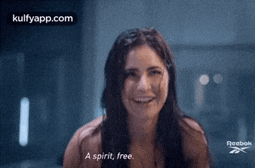 a woman is smiling and says `` a spirit , free . ''
