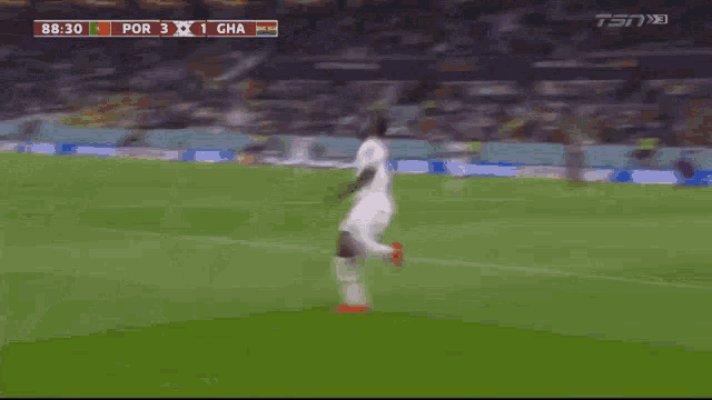 a soccer game is being played and the score is 3 to 2