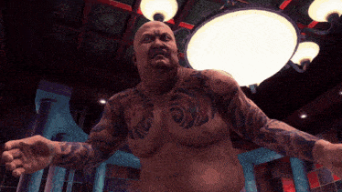 a bald man with a lot of tattoos on his chest and arms