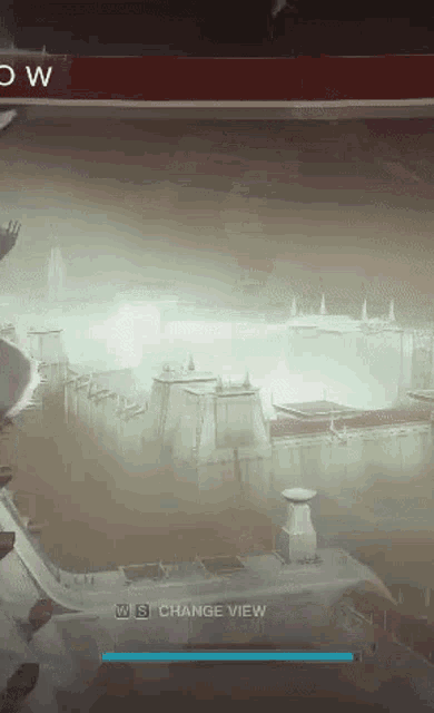a loading screen for a video game shows a city in the fog and says change view