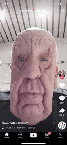 a screenshot of a man 's face on a cell phone