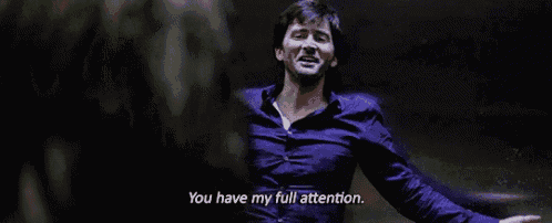 a man with his arms outstretched says you have my full attention