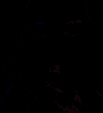 a woman covering her mouth with her hand in a dark room