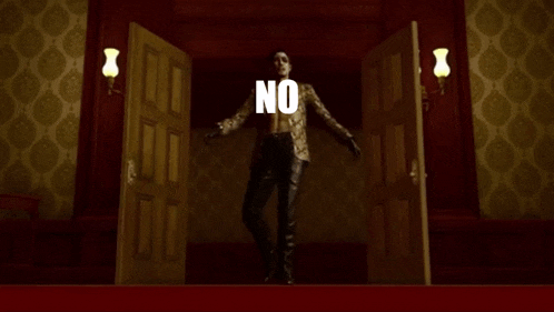 a man in a suit is standing in front of a door that says no on it