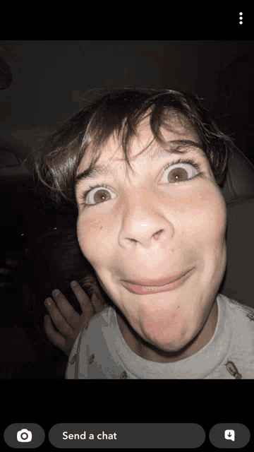 a screenshot of a person making a funny face with the words send a chat below it