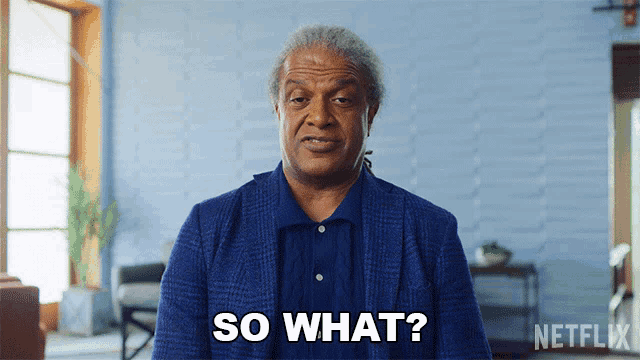 an older man in a blue suit says so what