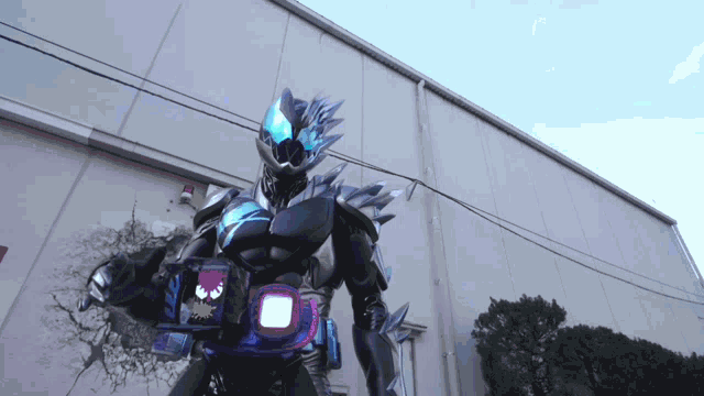 a man in a robot costume is standing in front of a wall