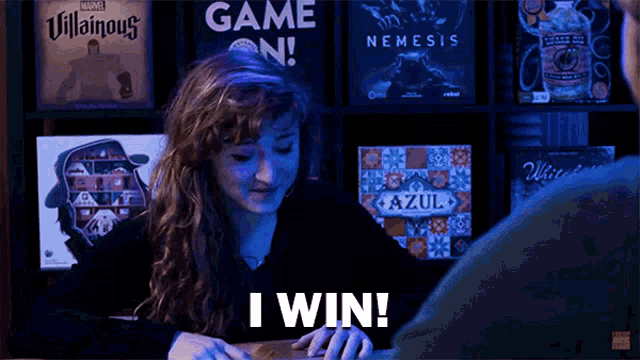 a woman playing a game with the words i win