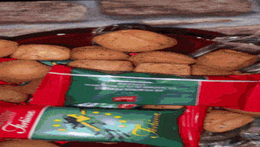 a bag of tortina cookies sits next to a bowl of cookies