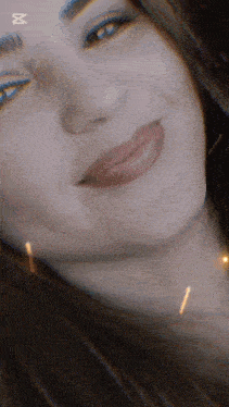 a close up of a woman 's face with the letters x and y visible