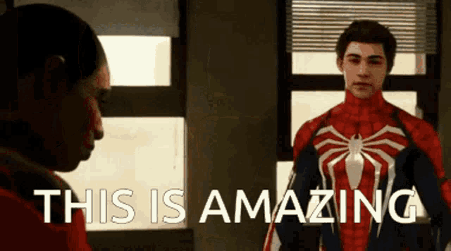 a man in a spiderman suit is standing next to another man with the words " this is amazing " written on the bottom